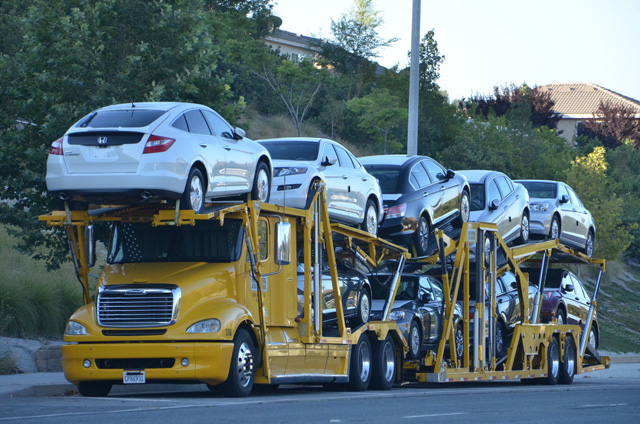Moving automobiles on a car carrier tractor-trailer