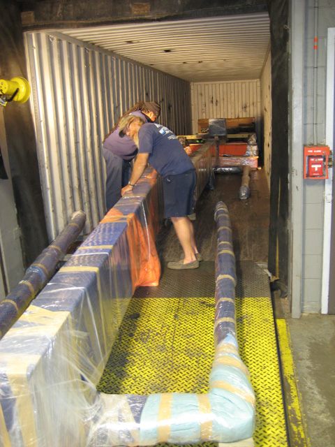 Loading art exhibit into ocean freight containers