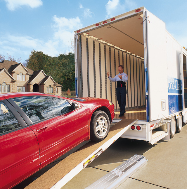 Loading a vehicle on an enclosed trailer