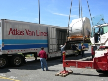 Hoisting a high-value MRI radiology machine onto one of our trailers