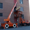 Moving digital telephone equipment into a 2nd floor equipment entry door